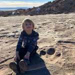 image for Went for a hike in Moab, UT. Found a dinosaur track. 3 yr old for scale.