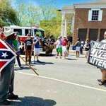 image for black man with confederate flag and white man with black lives matter flag.