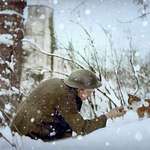 image for British soldier playing with a kitten in the snow, December 17, 1917