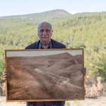 image for This man with a picture of the forest he restored