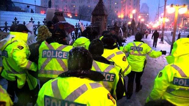 image for Ottawa police arrest convoy organizers but others remain defiant