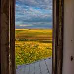 image for ITAP out the second story window in an abandoned farmhouse in eastern Montana