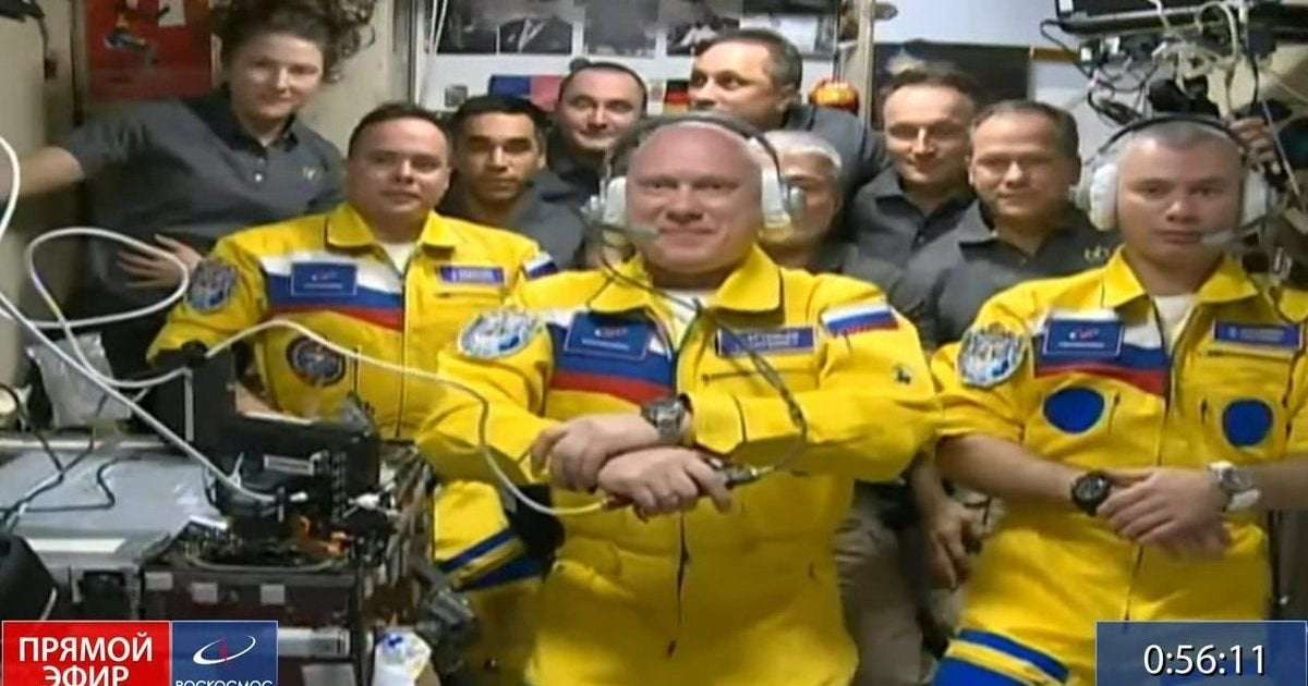 image for Three Russian cosmonauts wear colours of Ukrainian flag as they arrive on space station