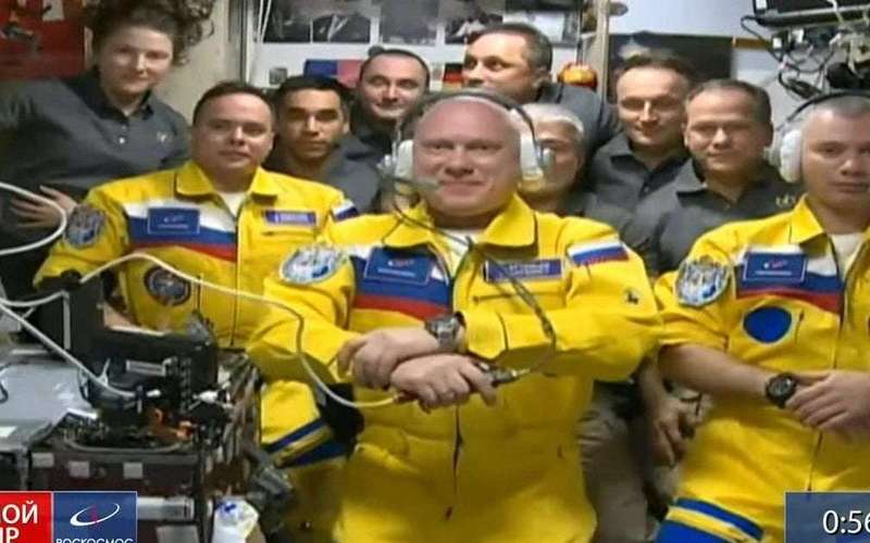 image for Three Russian cosmonauts wear colours of Ukrainian flag as they arrive on space station