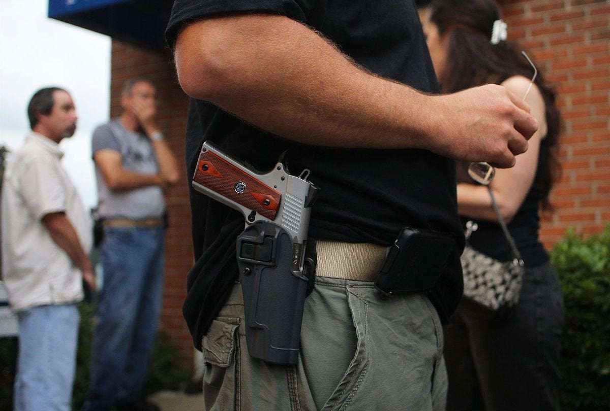 image for Pro-Trump group sent armed members door-to-door in Colorado to “intimidate” voters: Lawsuit
