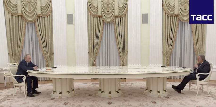 image for Putin breaks out the Kremlin's ridiculously long table to meet with the head of the UN