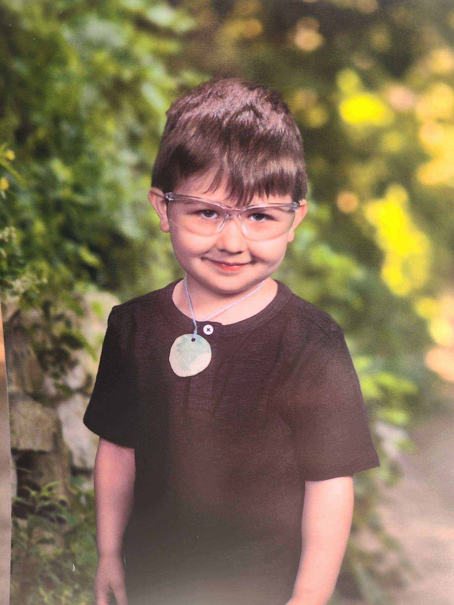 image showing My nephew snuck safety goggles to his school photo.