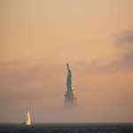 image for ITAP of the Statue of Liberty rising from the fog during sunset