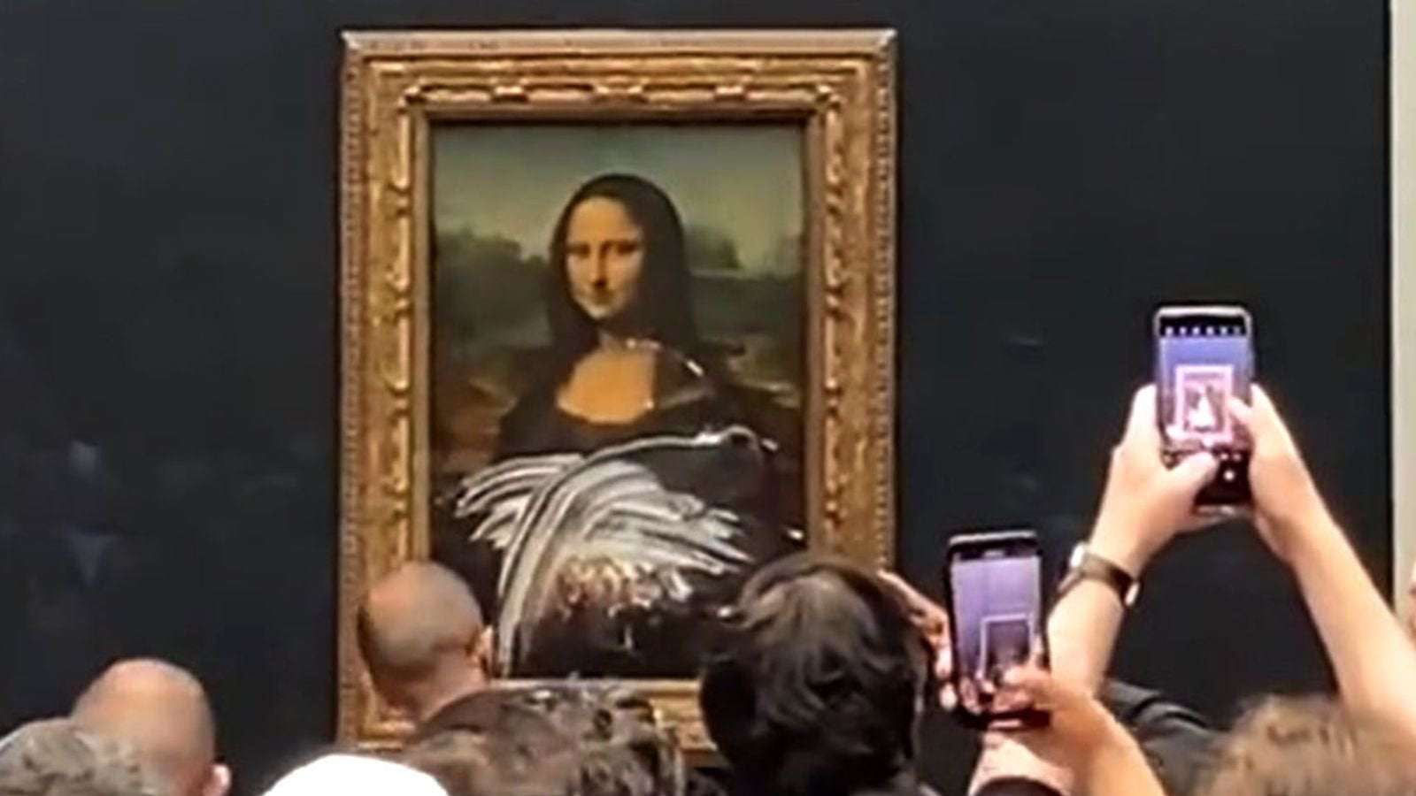 image for Mona Lisa attacked with cake by 'man dressed as old lady in wheelchair'