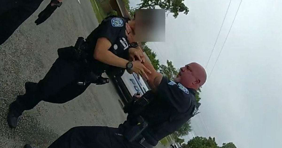 image for Florida police sergeant seen grabbing officer by the throat is charged with battery and assault