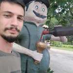 image for Me (left) with a statue of my ancestor in southern Brazil [OC]