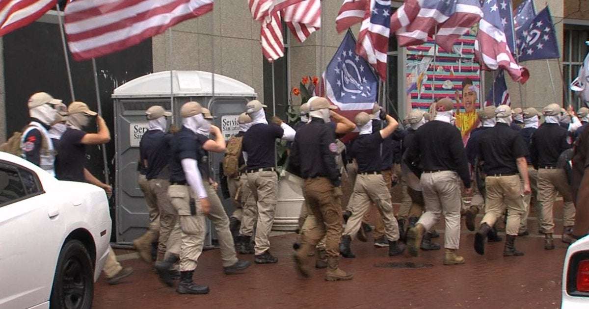 image for Patriot Front, a group considered to be white nationalists, seen marching through downtown Indianapolis