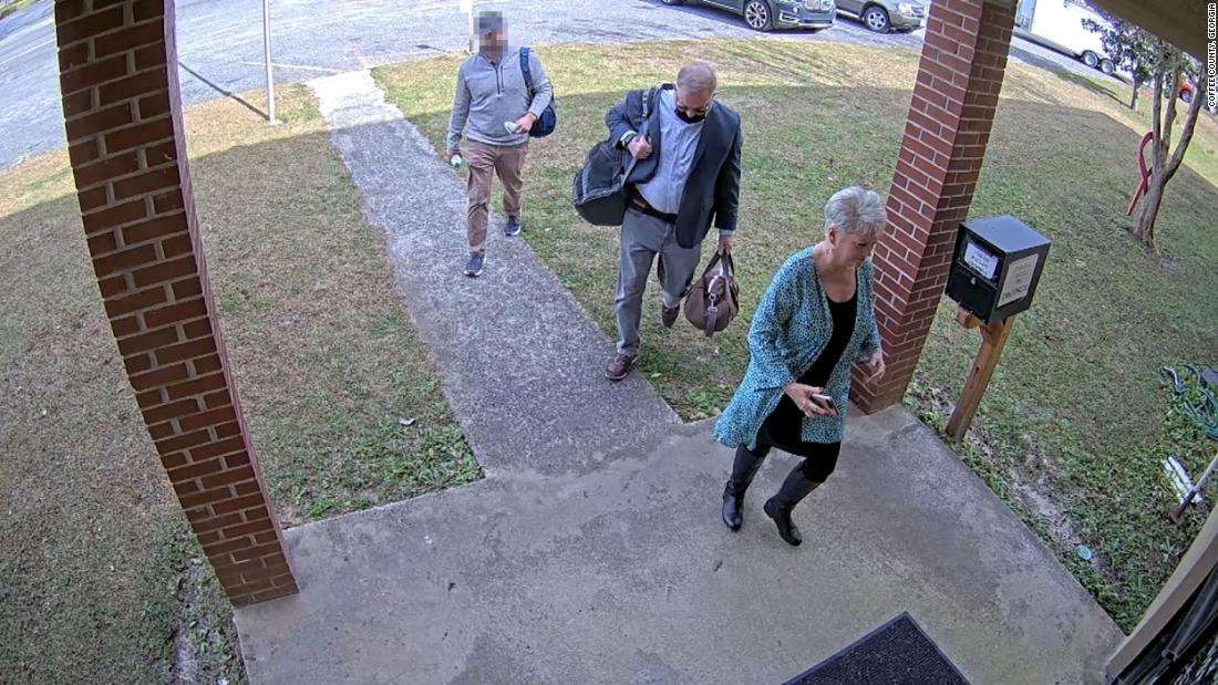 image for Newly obtained surveillance video shows fake Trump elector escorted operatives into Georgia county's elections office before voting machine breach