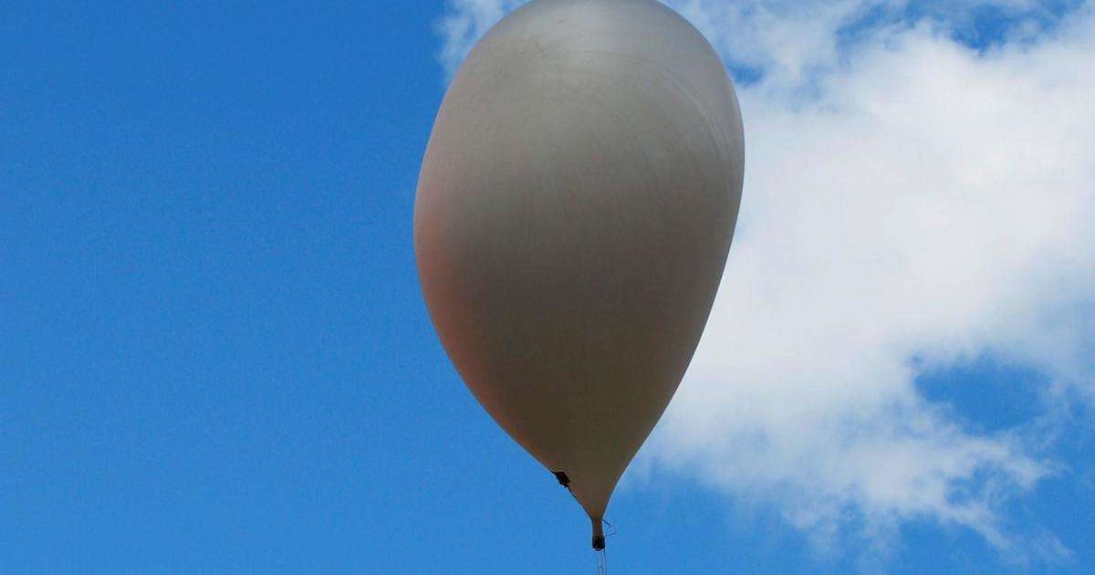 image for Chinese man gets trapped aloft in hydrogen balloon for 2 days, traveling 200 miles. He was trying to collect pine nuts from a tree.