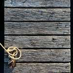 image for ITAP of a weathered wooden pier with a rope on a cleat