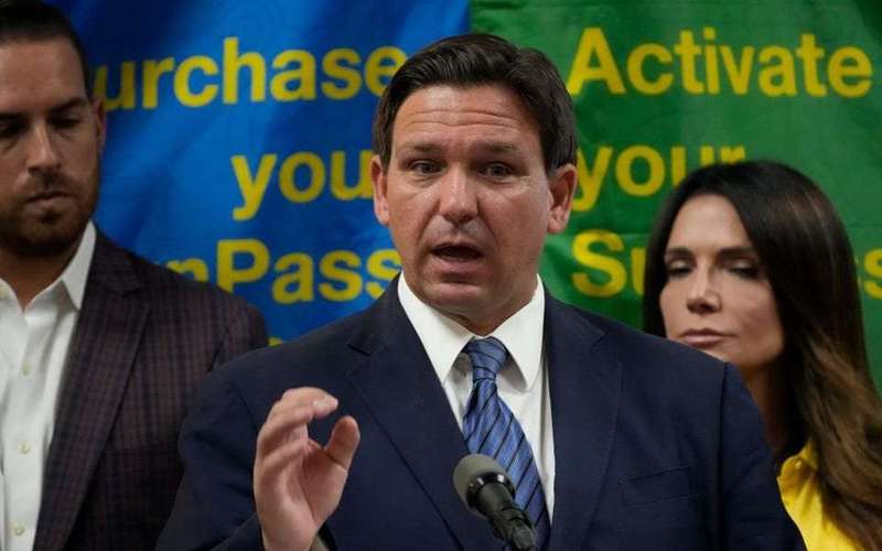 image for Florida officials made fake 'official-looking' brochure advertising refugee benefits for migrants, lawsuit against Ron DeSantis says
