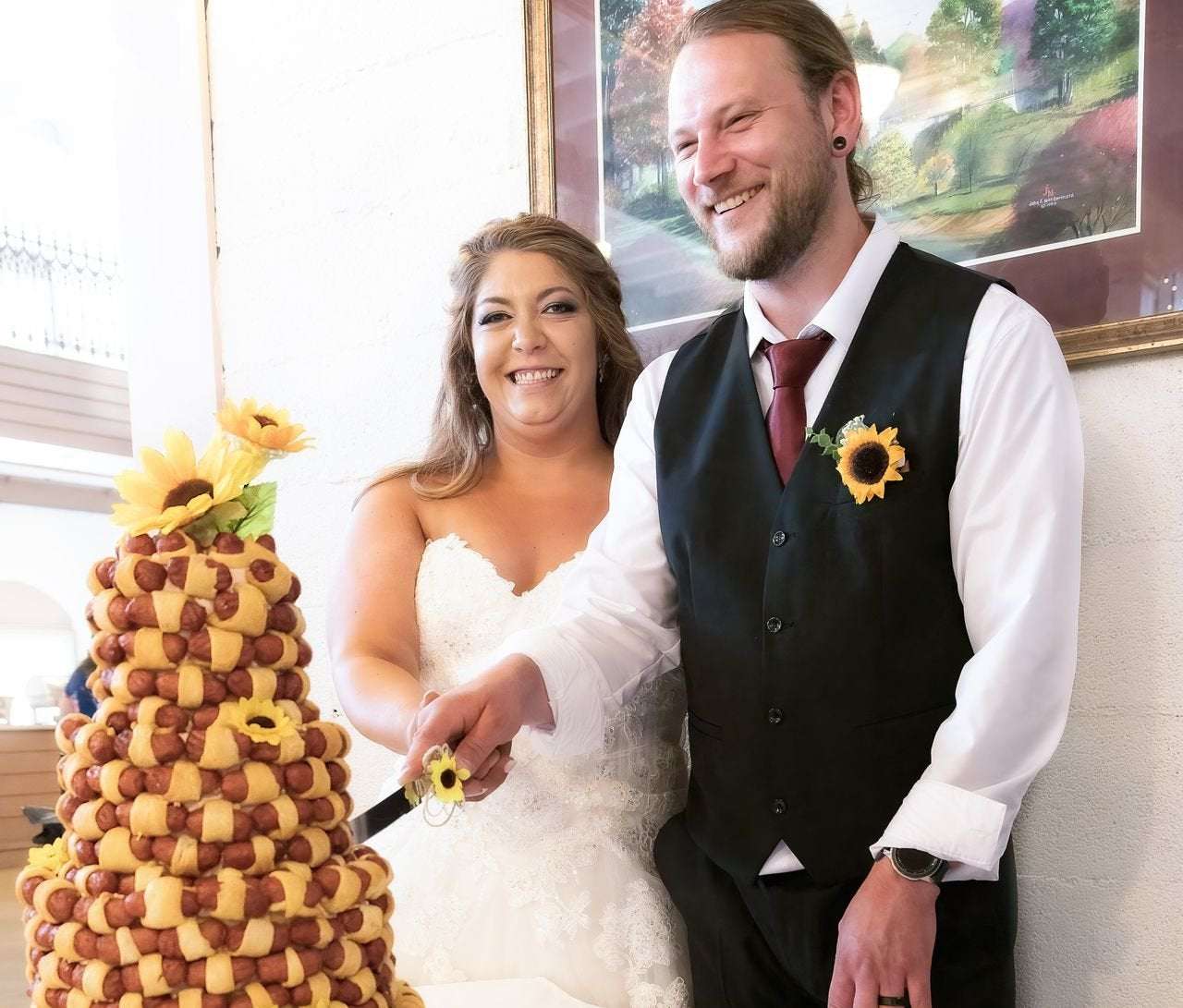 image for Michigan couple gifted custom, four-tiered cocktail sausage cake on their wedding day