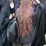 image for Iranian woman with her hair exposed in front of the pro-islamic republic counter-protest