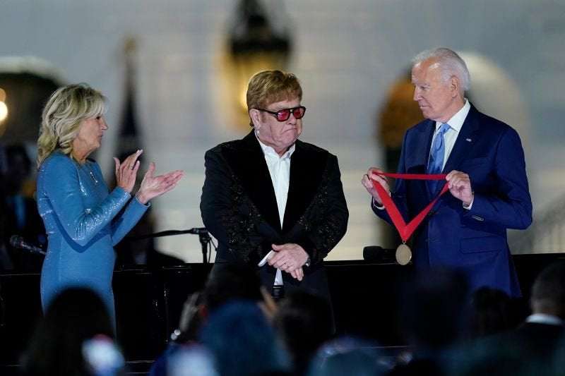 image for Biden surprises Elton John with National Humanities Medal at White House