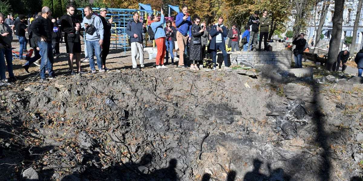 image for Russia says its missiles hit Ukrainian military targets, but videos of a burning crater in a Kyiv park paint a very different picture
