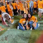 image for A Tennessee fan taking a souvenir after winning over Alabama.