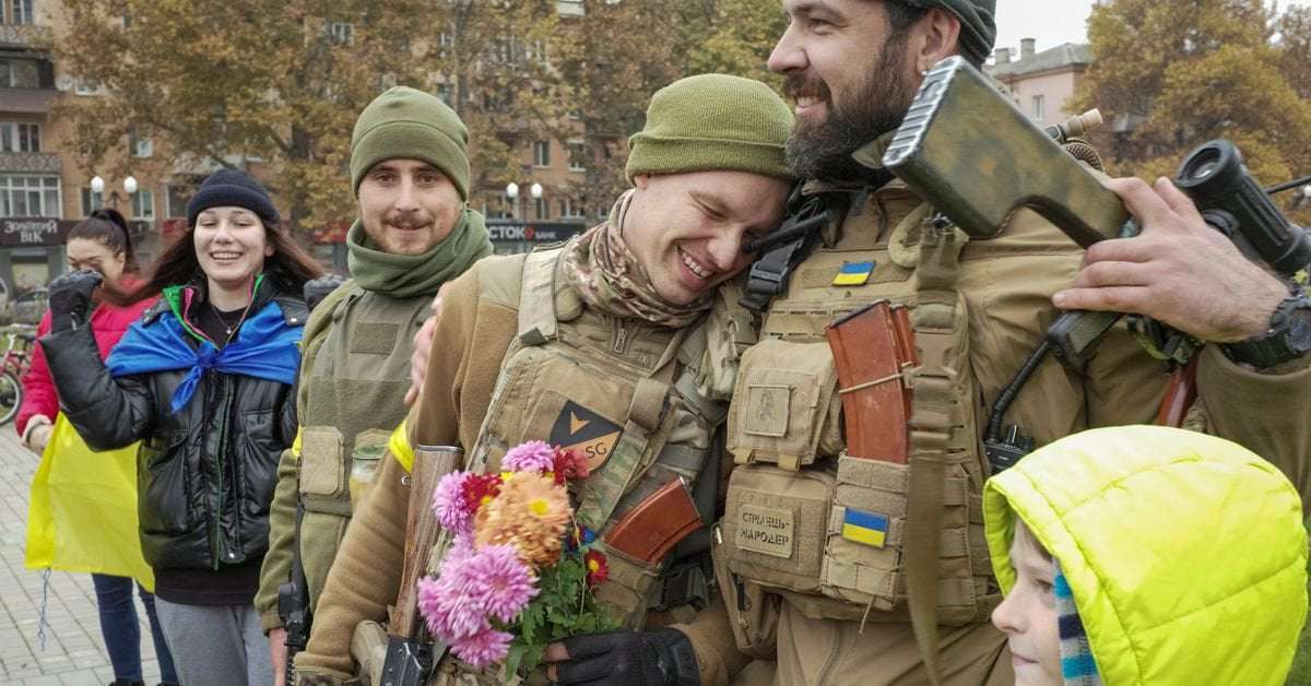 image for Ukraine troops greeted with flowers in Kherson after Russian retreat