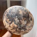 image for After five years of use my pizza stone looks like the moon.