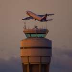 image for ITAP of a FedEx freighter banking over the control tower.