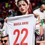 image for Iranian spectator showing football shirt with Mahsa Amini name written on it - Iran and wales match