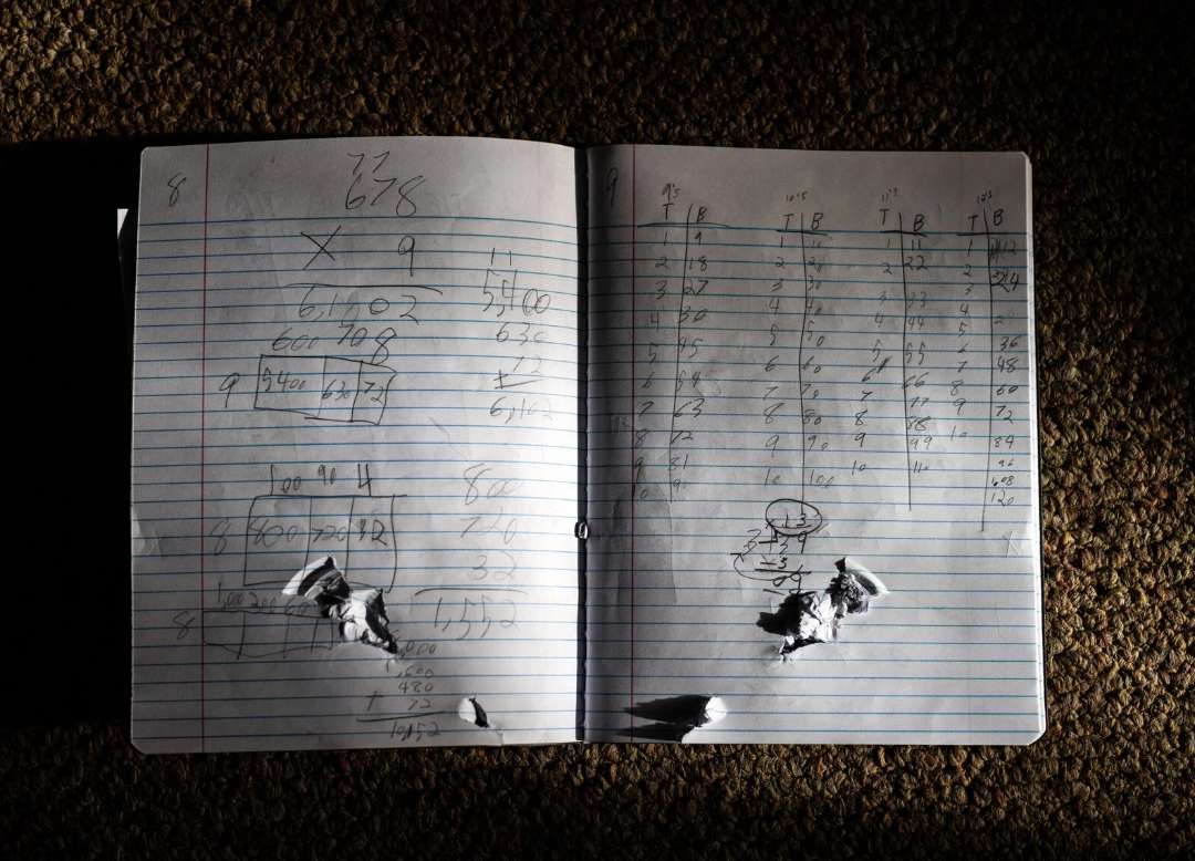 image showing 10-year-old Uziyah Garcia's math notebook, with a bullet hole through it