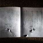 image for 10-year-old Uziyah Garcia's math notebook, with a bullet hole through it