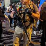 image for A armed counter-protester in San Antonio last night. He is a member of Veterans For Equality.