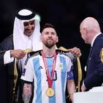 image for The Prince of Qatar decorates Messi with a traditional royal gown, after winning the World Cup.
