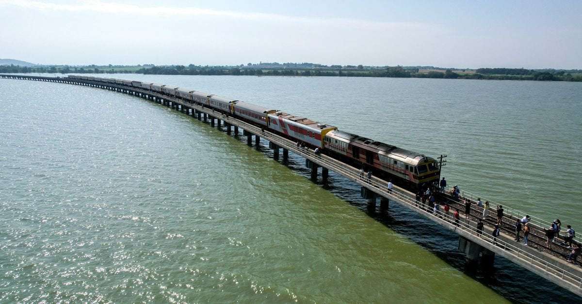 image for Thailand's 'floating train' a big hit as dam waters rise