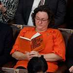 image for Rep. Katie Porter reading during the speaker of the house vote.