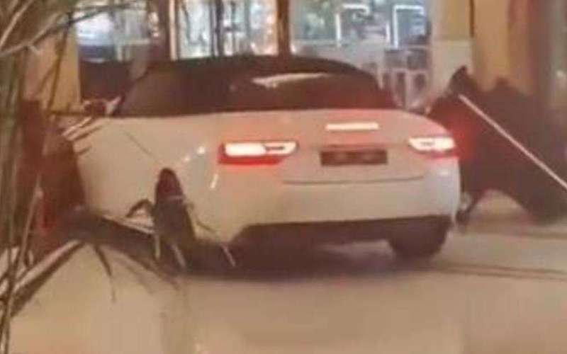 image for Wild video shows angry guest smashing sports car through Chinese hotel lobby: "Are you crazy?"