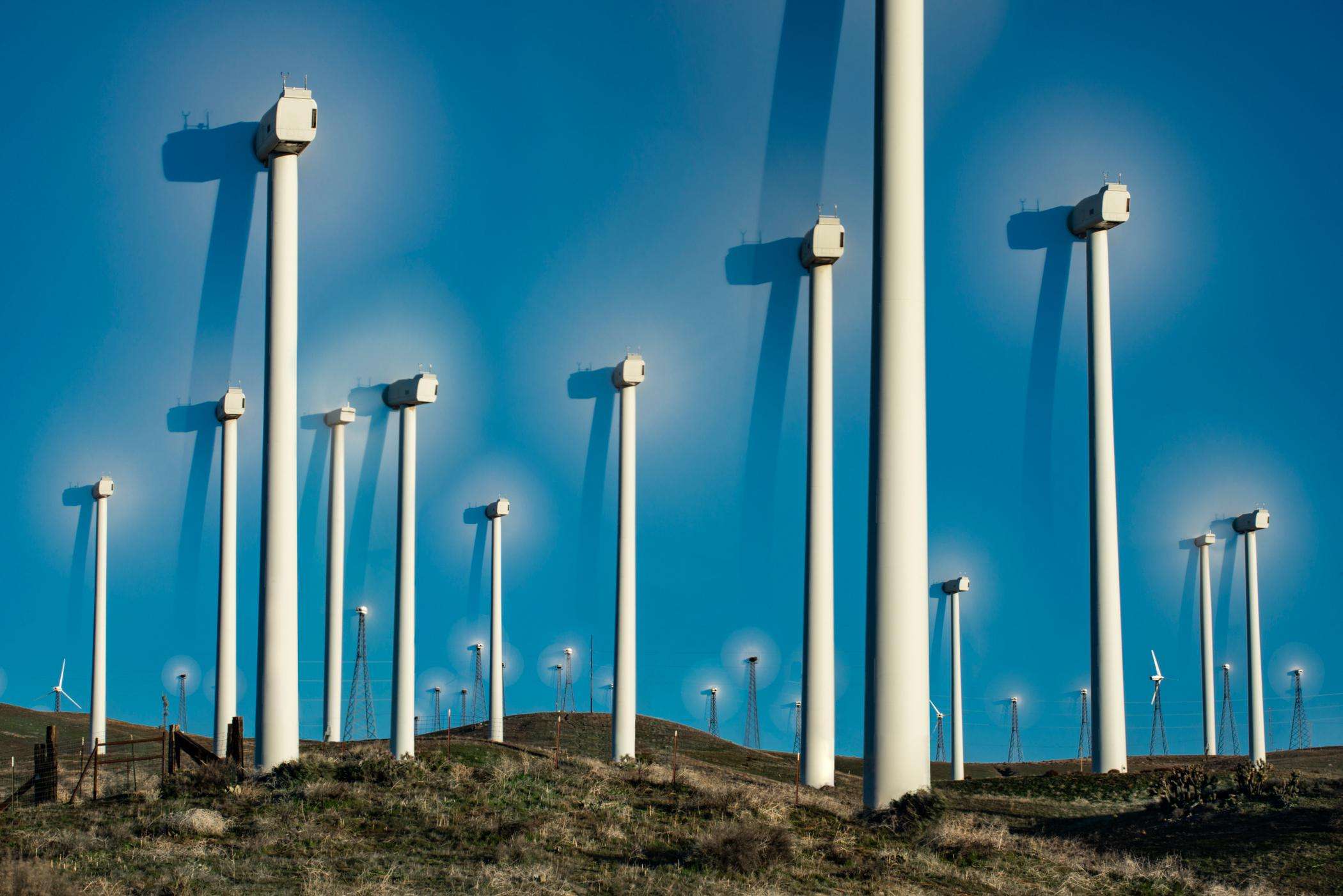 image showing Long exposure photo of wind turbines