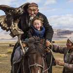 image for Man taking grandson and an eagle on hunt in the Altai Mountains of Central Asia
