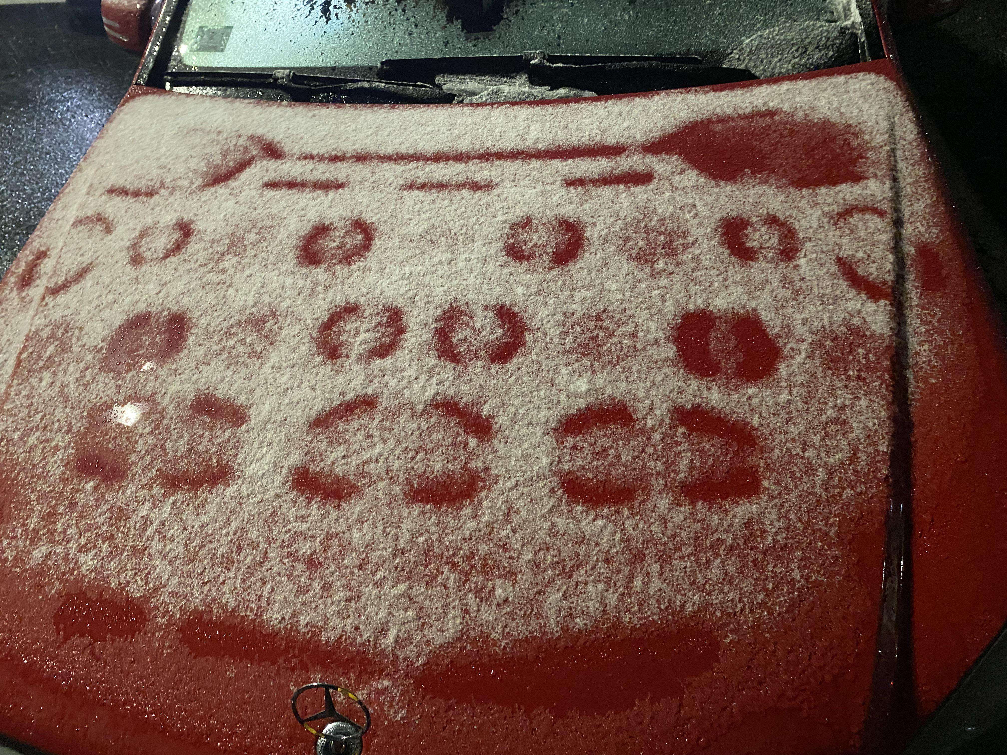 image showing Went to the store during a snowstorm, came back to these weird patterns on the hood of my car