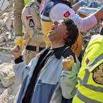 image for A Photo of a Man celebrating after his Mother was found alive, 176 hours after the earthquake.