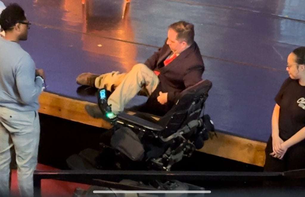 image for Denver City Council candidate Chris Hinds forced to crawl onstage for debate