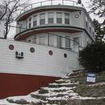 image for I'll see your front yard pirate ship and raise you my late uncle's cottage shaped like a boat