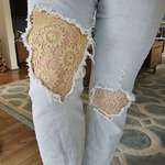 image for My jeans were getting a little too distressed, so I sewed doilies into them
