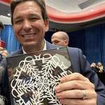 image for DeSantis accepts snowflake gift without looking closely