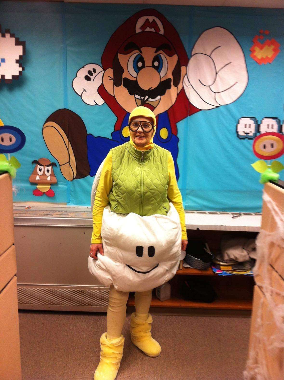 image showing My Mom, who designed a Mario themed party at her office (all by hand) dressed as Cloud guy!