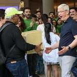 image for Apple CEO Tim Cook, reacting to an old Macintosh Classic machine brought by a visitor
