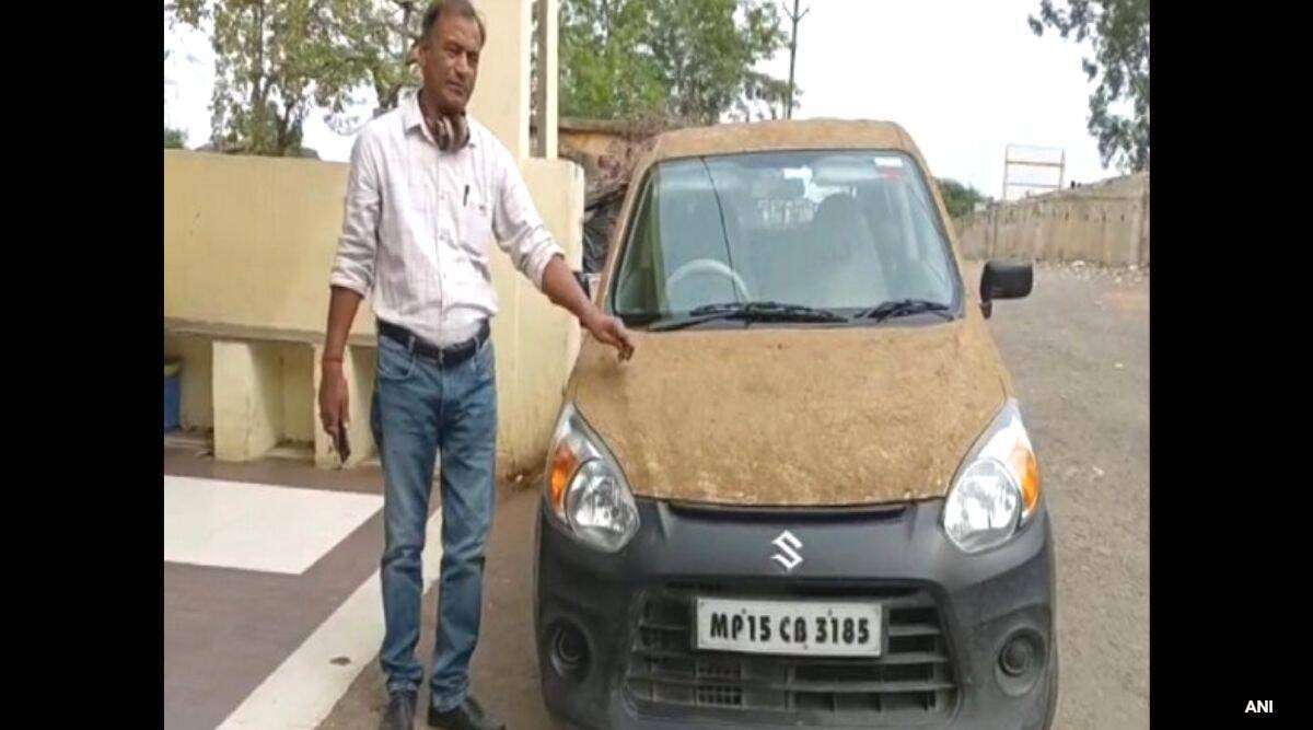 image for ‘Sunscreen for car’: Homeopathic doctor coats car with cow dung to beat the heat