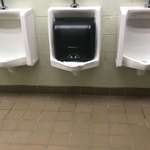 image for Someone tore off the paper towel dispenser and shoved it in the urinal at my college... why