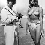 image for A policeman issues a ticket to a woman for wearing a bikini, 1957