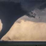 image for Tornado next to wind turbines.